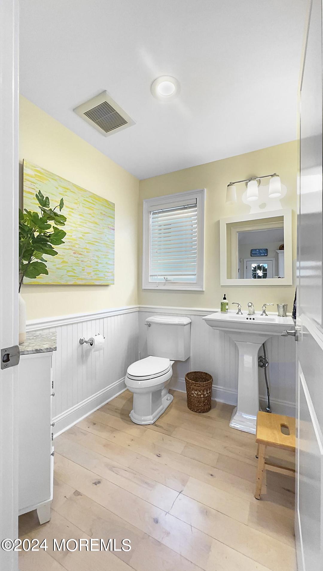 9 Pocano Avenue, Unit A Oceanport, NJ 07757 - Photo 19 of 29 a bathroom with a toilet sink and mirror