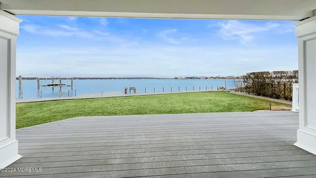 a front view of a house with a garden and yard
