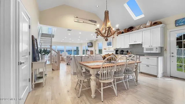 a dining room with furniture and wooden floor