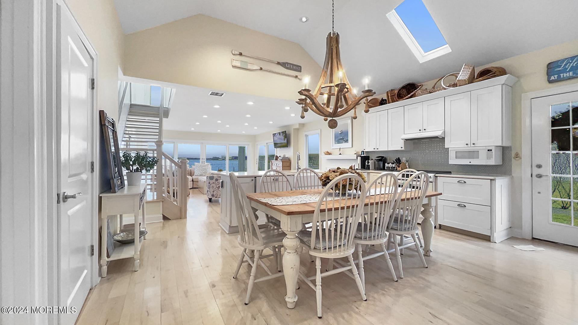 9 Pocano Avenue, Unit A Oceanport, NJ 07757 - Photo 5 of 29 a dining room with furniture and wooden floor