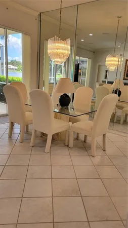 a view of a dining room with furniture and windows