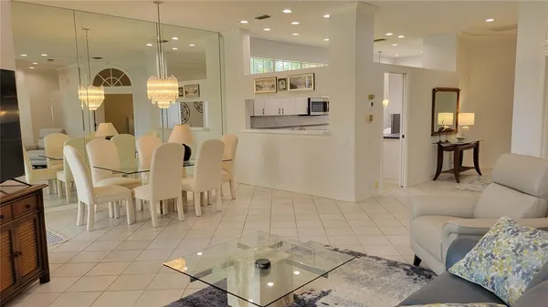 a large kitchen with a table and chairs