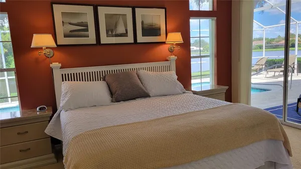 a bedroom with a large bed and a window