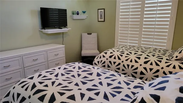 a bedroom with a bed and a cabinets