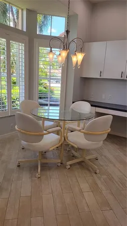 a view of a room with gym equipment and windows