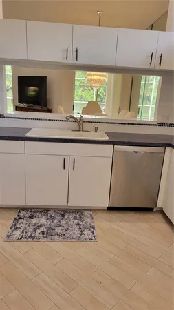 a kitchen with a sink and a microwave