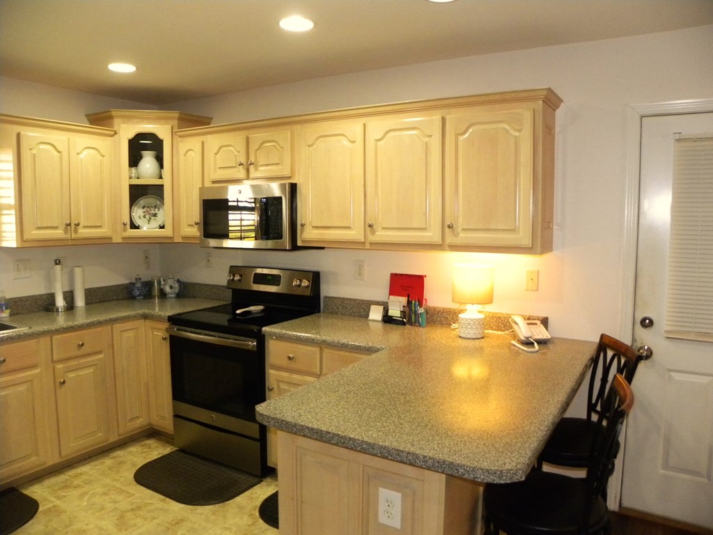 88 Morningview Place Blue Ridge, GA 30513 - Photo 11 of 41 a kitchen with a sink a stove and chairs