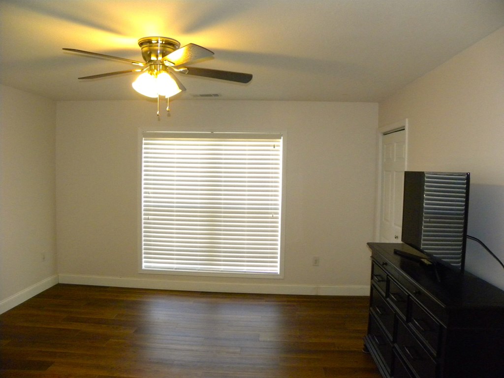 88 Morningview Place Blue Ridge, GA 30513 - Photo 17 of 41 a view of an empty room with wooden floor and a window