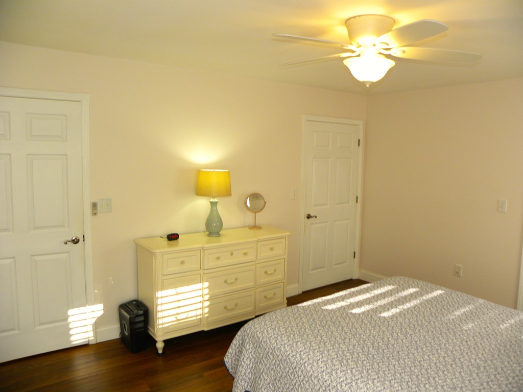 88 Morningview Place Blue Ridge, GA 30513 - Photo 22 of 41 a bedroom with a bed and a chandelier