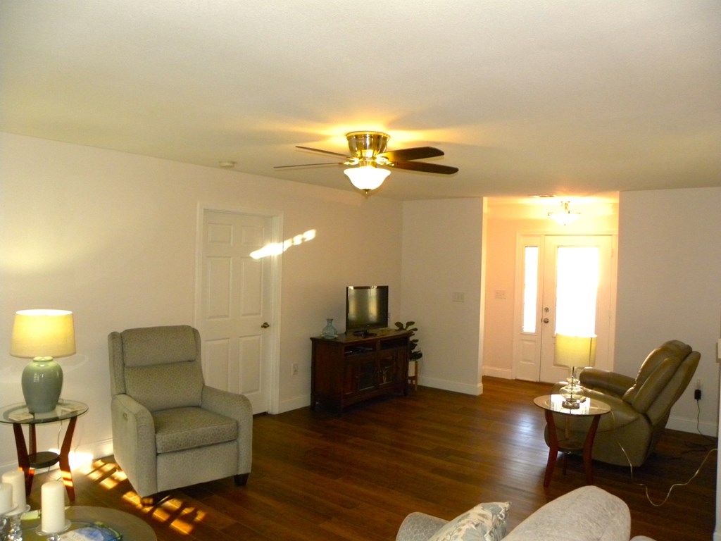 88 Morningview Place Blue Ridge, GA 30513 - Photo 31 of 41 a living room with furniture and a chandelier