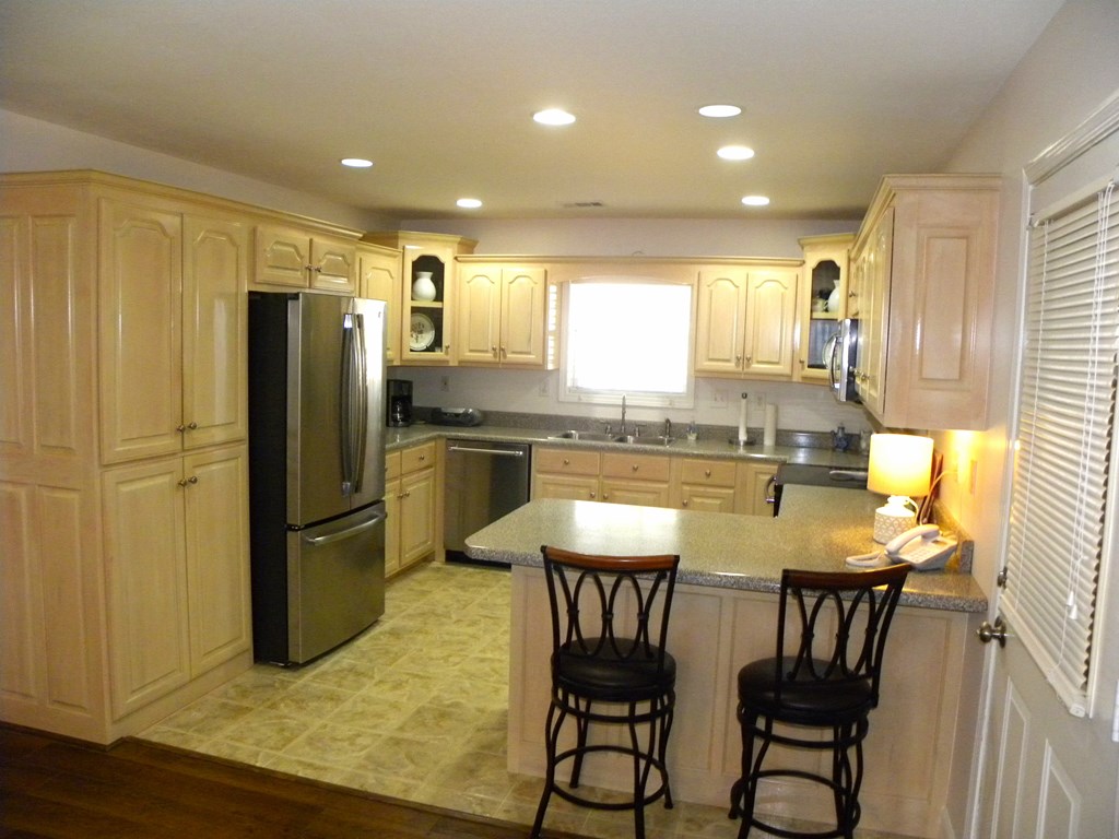 88 Morningview Place Blue Ridge, GA 30513 - Photo 10 of 41 a kitchen with stainless steel appliances granite countertop a refrigerator a sink a stove a dining table and chairs