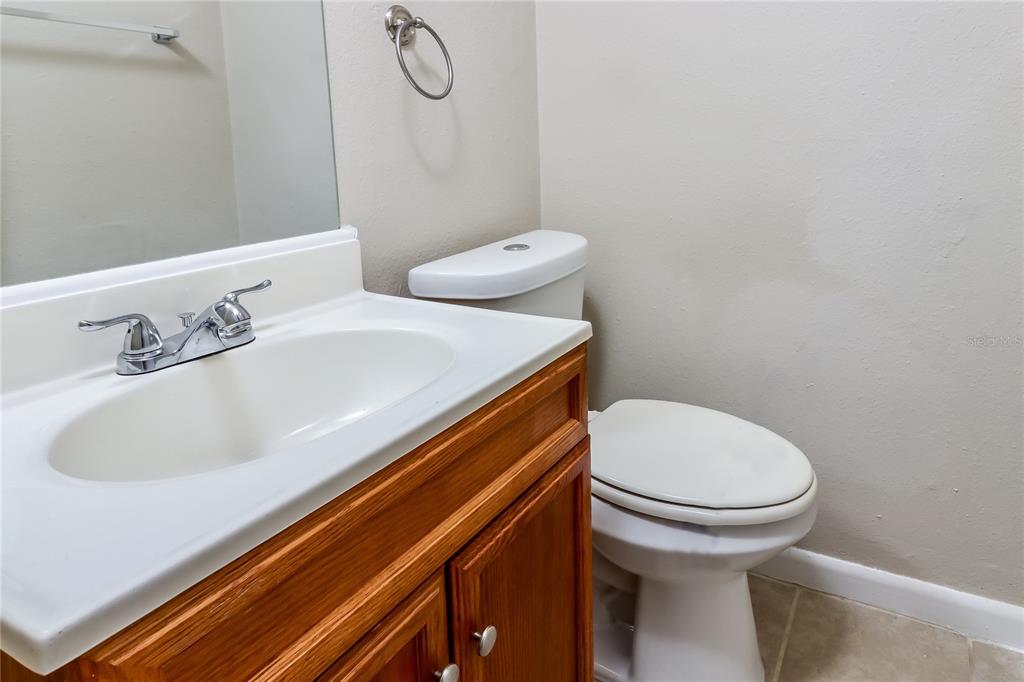 8653 Sabal Way Port Richey, FL 34668 - Photo 13 of 16 a bathroom with a sink and a toilet