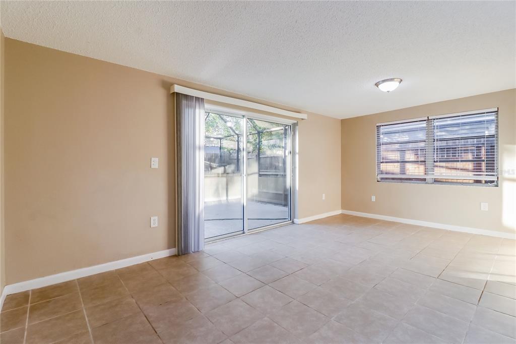 8653 Sabal Way Port Richey, FL 34668 - Photo 4 of 16 an empty room with windows