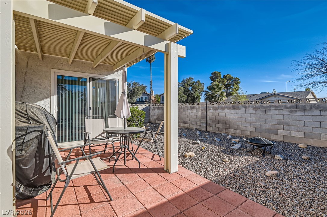 3665 Bronco Road Las Vegas, NV 89103 - Photo 23 of 28 A spacious brick patio leads to a low-maintenance yard, perfect for outdoor enjoyment.