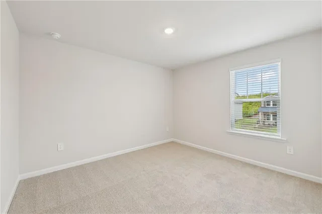 a view of a house with a garden and pathway