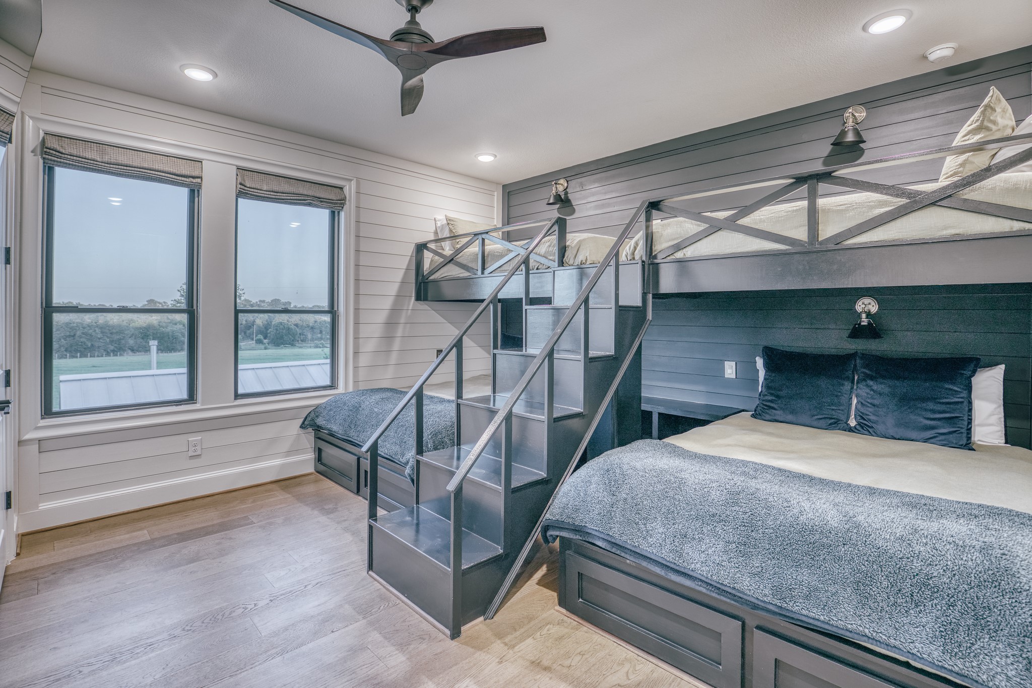 1034 Hilbun Road New Ulm, TX 78950 - Photo 26 of 49 Charming custom bunk room with built-in accommodations, private en-suite bath, and designer finishes that blend comfort, functionality, and style.