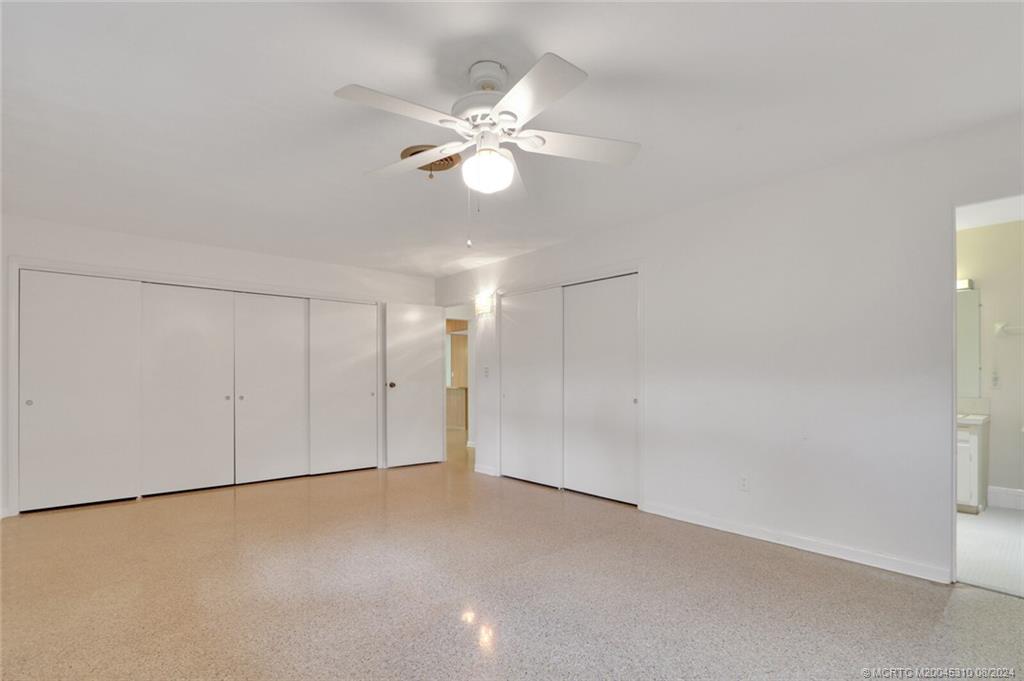 1230 Northwest Fork Road Stuart, FL 34994 - Photo 32 of 50 a view of a chandelier fan in a room