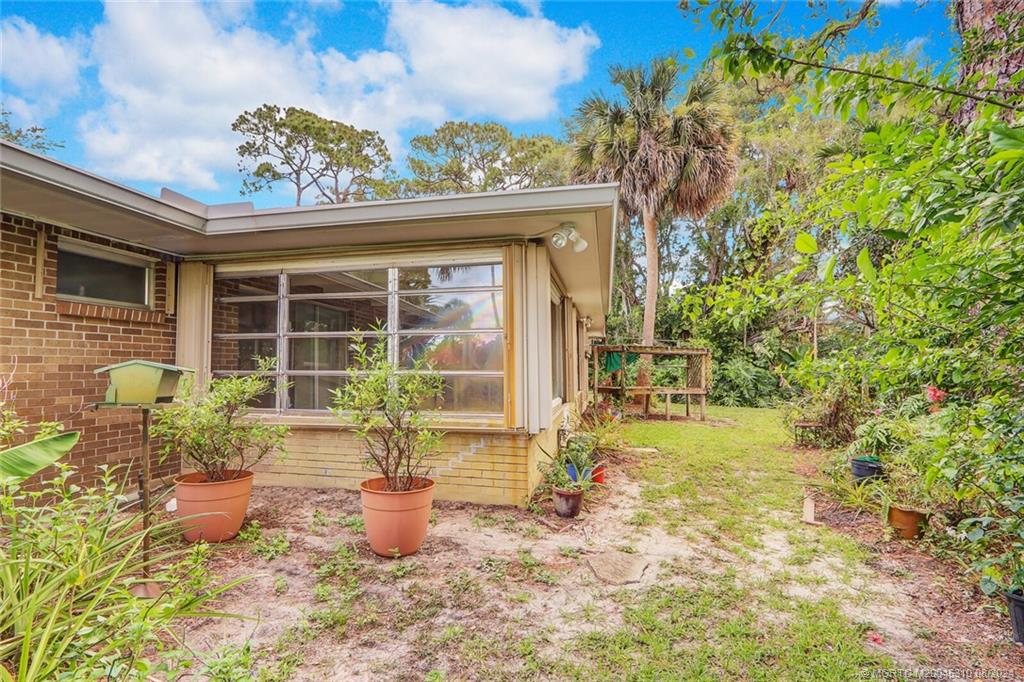 1230 Northwest Fork Road Stuart, FL 34994 - Photo 38 of 50 a front view of a house with a yard