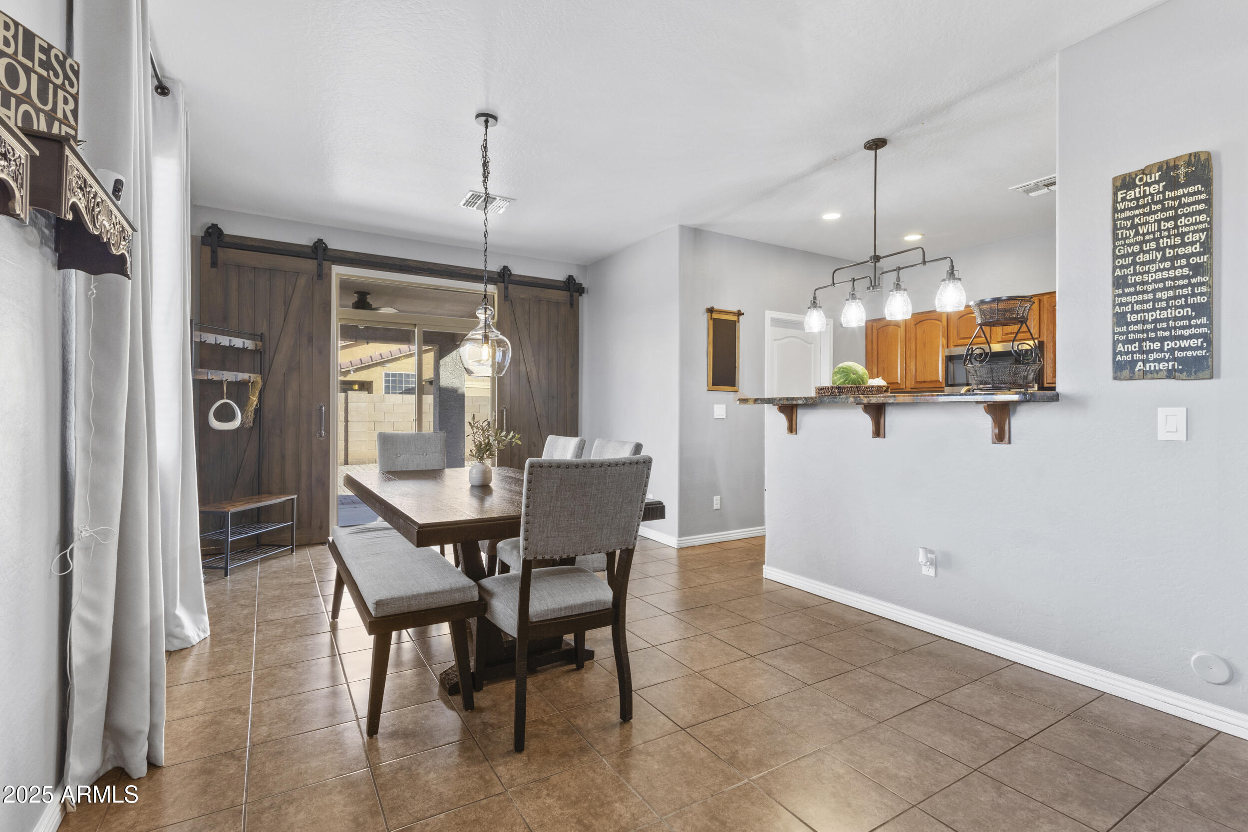 7305 West Darrel Road Laveen, AZ 85339 - Photo 6 of 26 Dining room exits to covered patio
