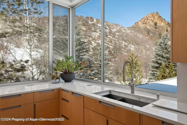 a kitchen with a sink and cabinets
