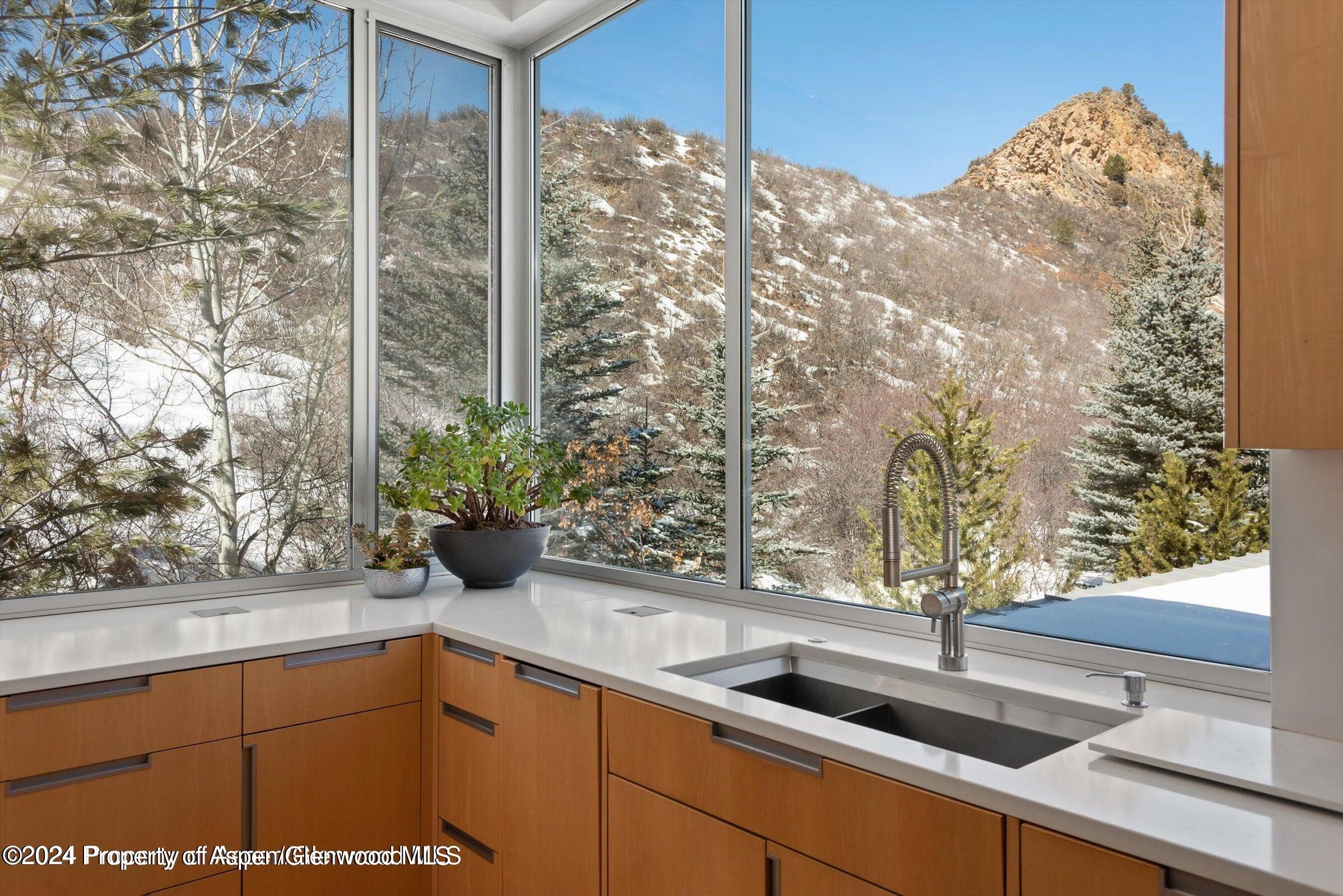 1015 Cemetery Lane Aspen, CO 81611 - Photo 14 of 46 a kitchen with a sink and cabinets
