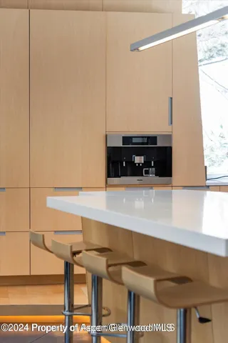 a view of storage and utility room with window