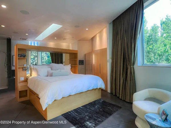 a bed room with a bed and a couch