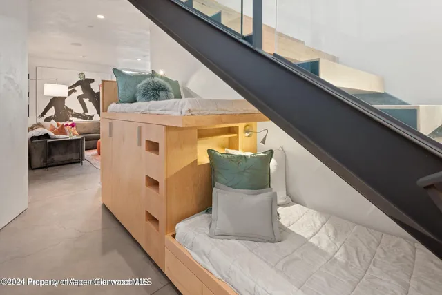 a bedroom with a large bed and a large window