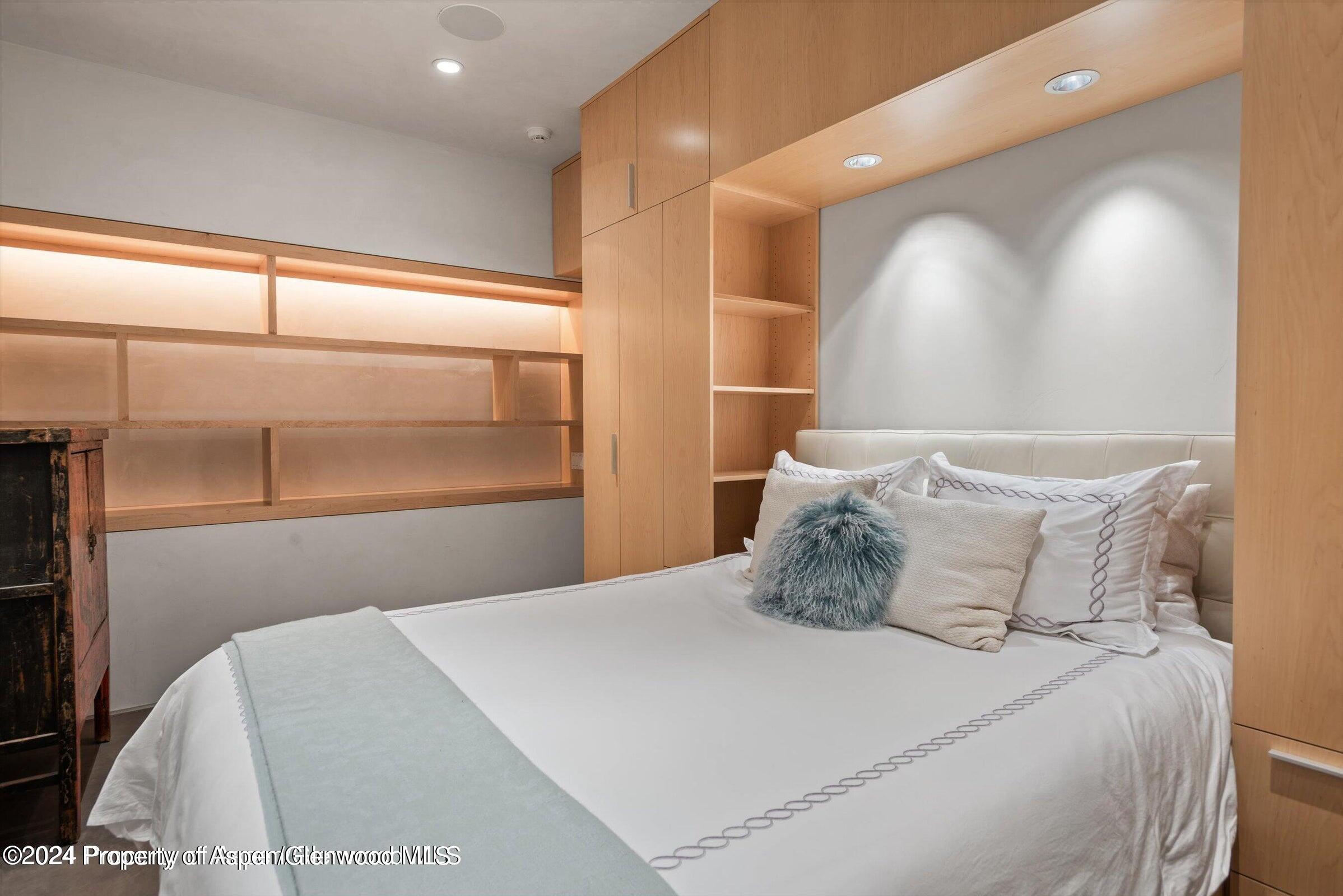 1015 Cemetery Lane Aspen, CO 81611 - Photo 34 of 46 a bedroom with a large bed and a large window