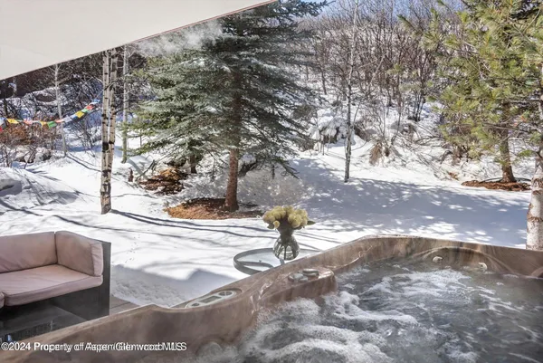 a bathroom with a sink mirror and toilet