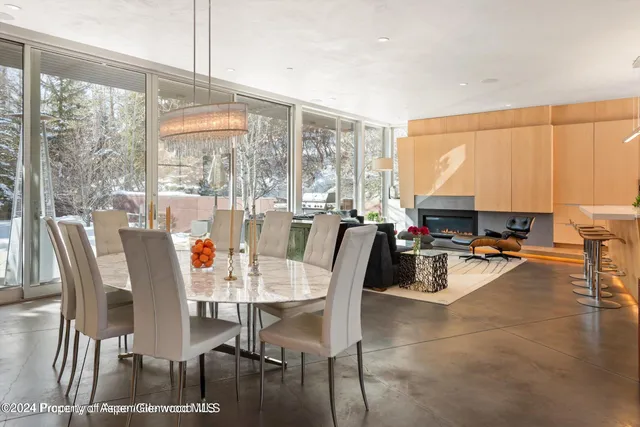 a view of a dining room with furniture window and outside view