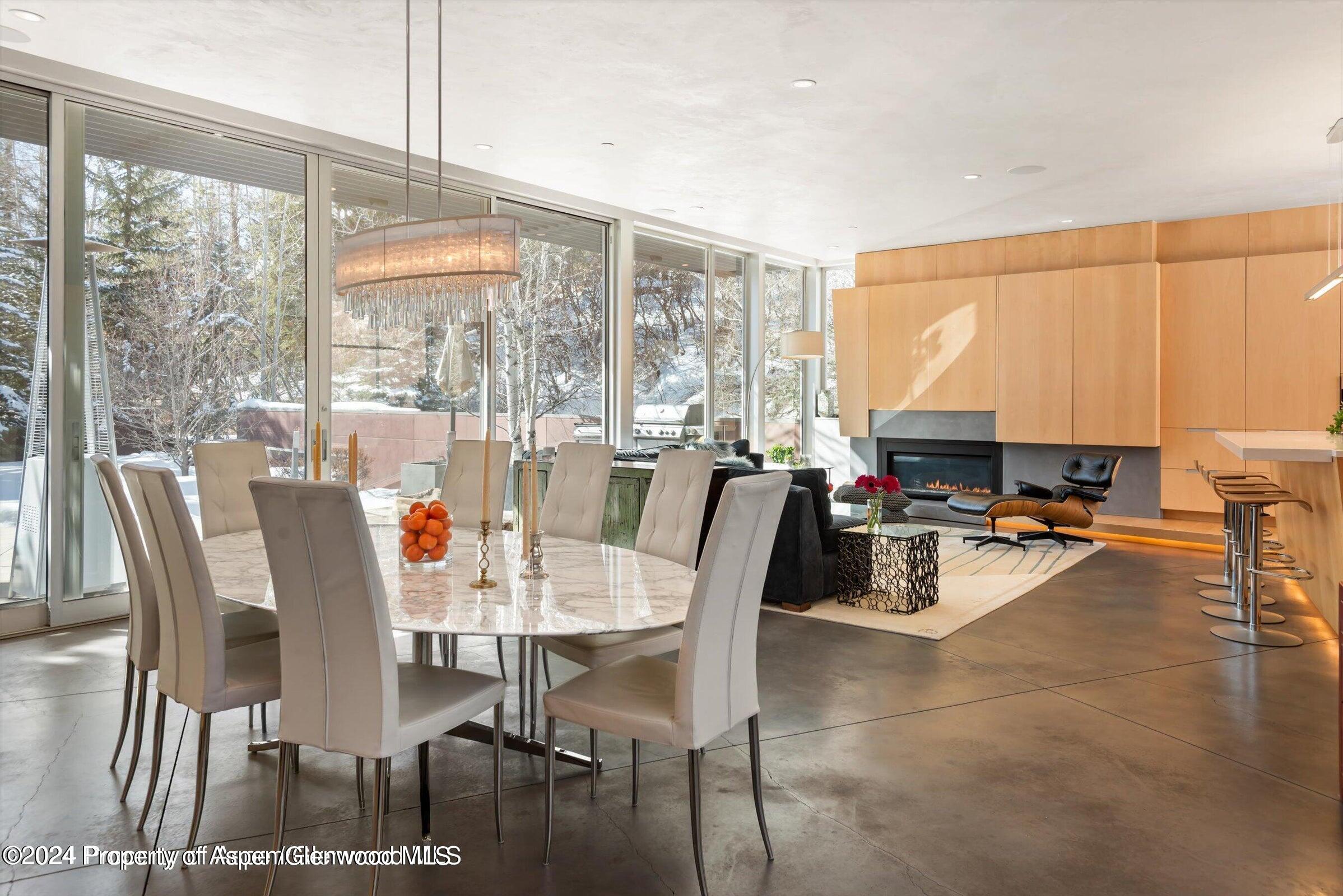1015 Cemetery Lane Aspen, CO 81611 - Photo 9 of 46 a view of a dining room with furniture window and outside view