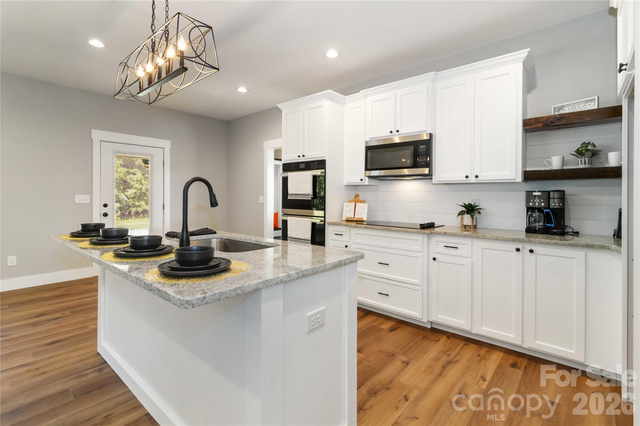 2605 Mt Prospect Road Chester, SC 29706 - Photo 11 of 35 a kitchen with sink a microwave and cabinets