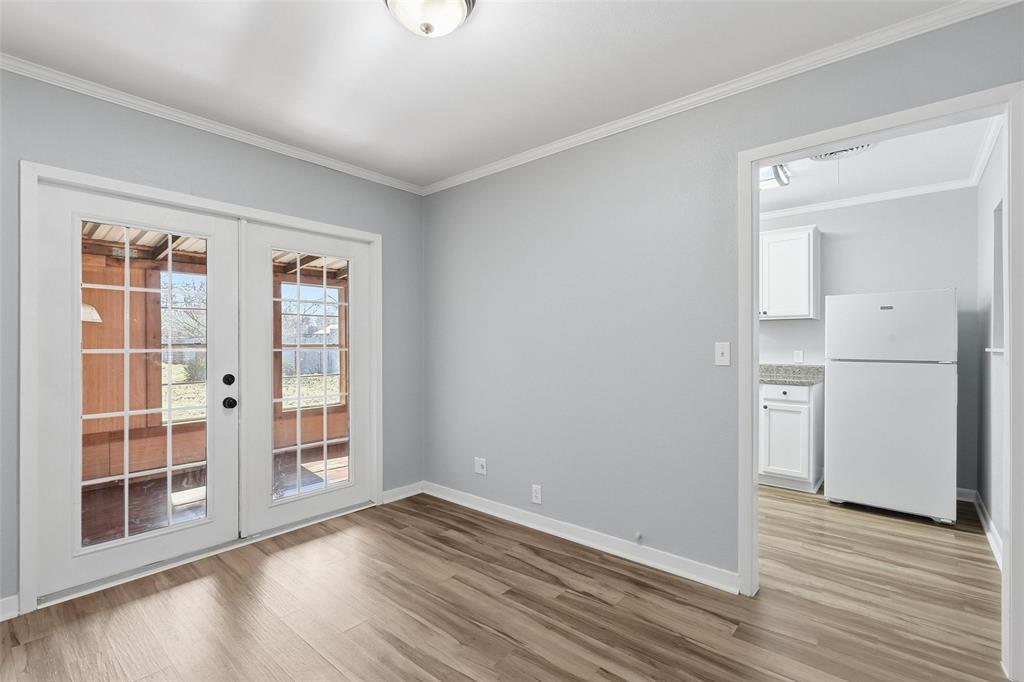 216 4th Street Joshua, TX 76058 - Photo 11 of 40 wooden floor in an empty room with a window