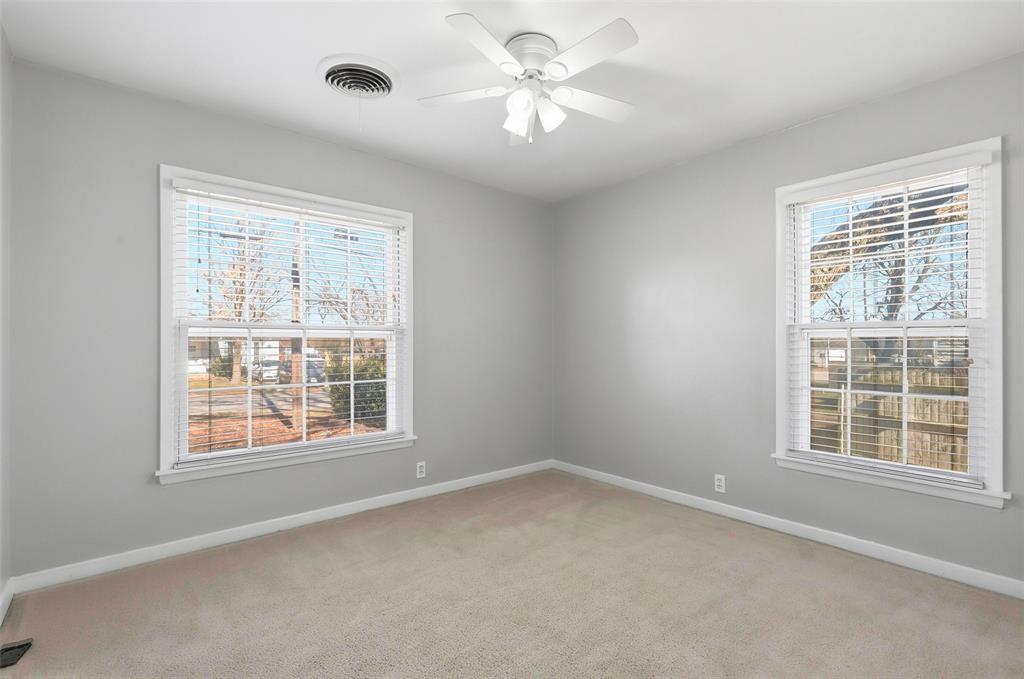 216 4th Street Joshua, TX 76058 - Photo 18 of 40 an empty room with a window and a fan