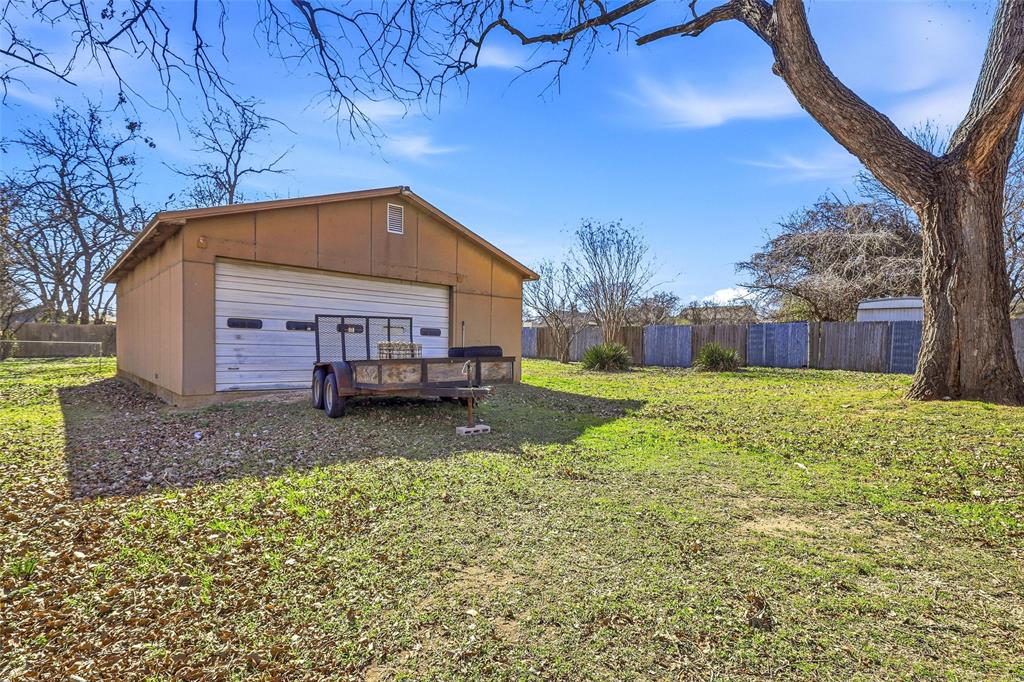 216 4th Street Joshua, TX 76058 - Photo 27 of 40 a view of house with backyard