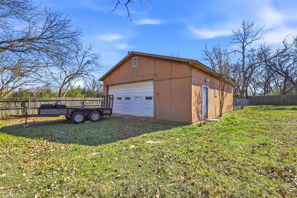 216 4th Street Joshua, TX 76058 - Photo 28 of 40 a view of a backyard with a garden
