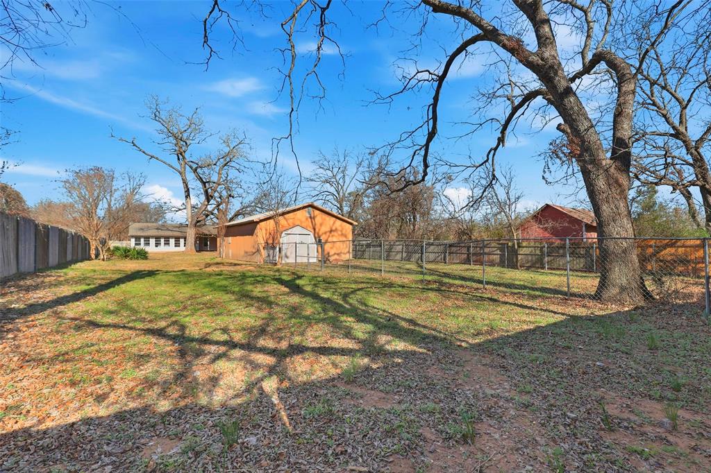 216 4th Street Joshua, TX 76058 - Photo 36 of 40 a view of yard along with trees