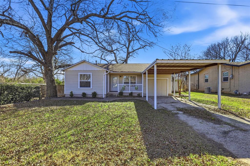 216 4th Street Joshua, TX 76058 - Photo 37 of 40 a view of a house with backyard and a tree