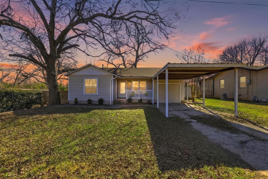 216 4th Street Joshua, TX 76058 - Photo 38 of 40 a view of a house with backyard and a tree