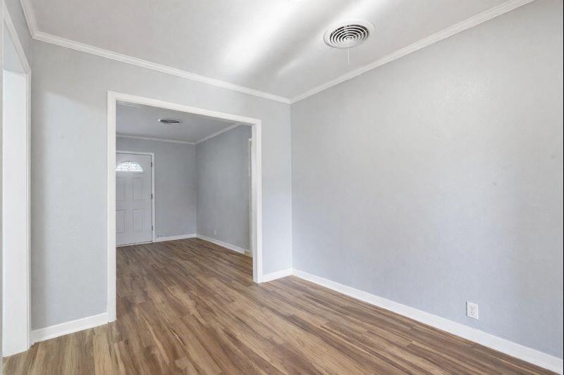 216 4th Street Joshua, TX 76058 - Photo 9 of 40 a view of an empty room with wooden floor