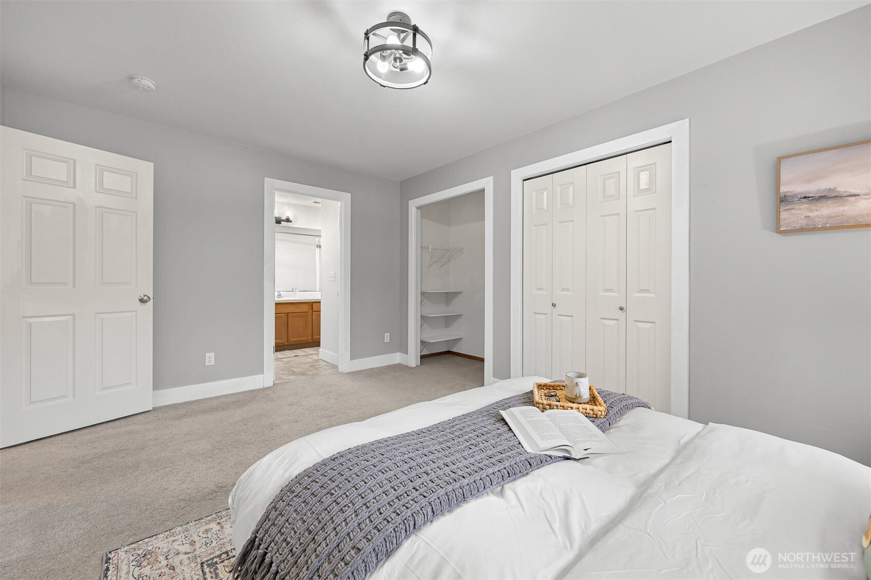 3500 South Avenue Bellingham, WA 98229 - Photo 16 of 38 a bedroom with a bed and a chandelier