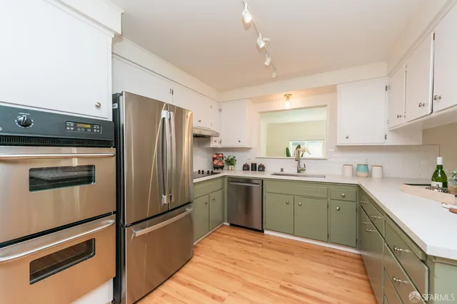 a view of a dining room with furniture and a chandelier