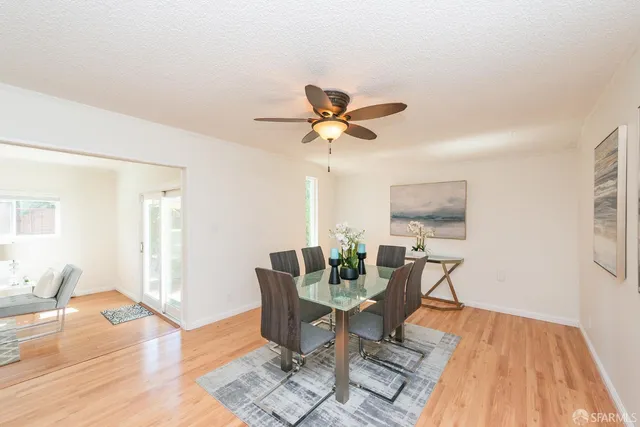 a room with a wooden floor and furniture