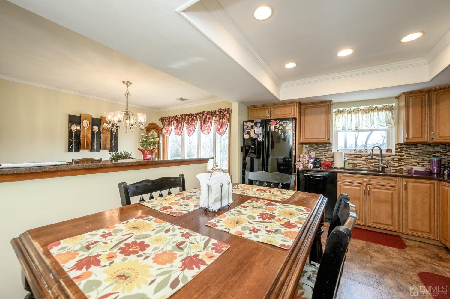 7 Putters Road Succasunna, NJ 07876 - Photo 11 of 40 a living room with stainless steel appliances kitchen island granite countertop furniture and a table