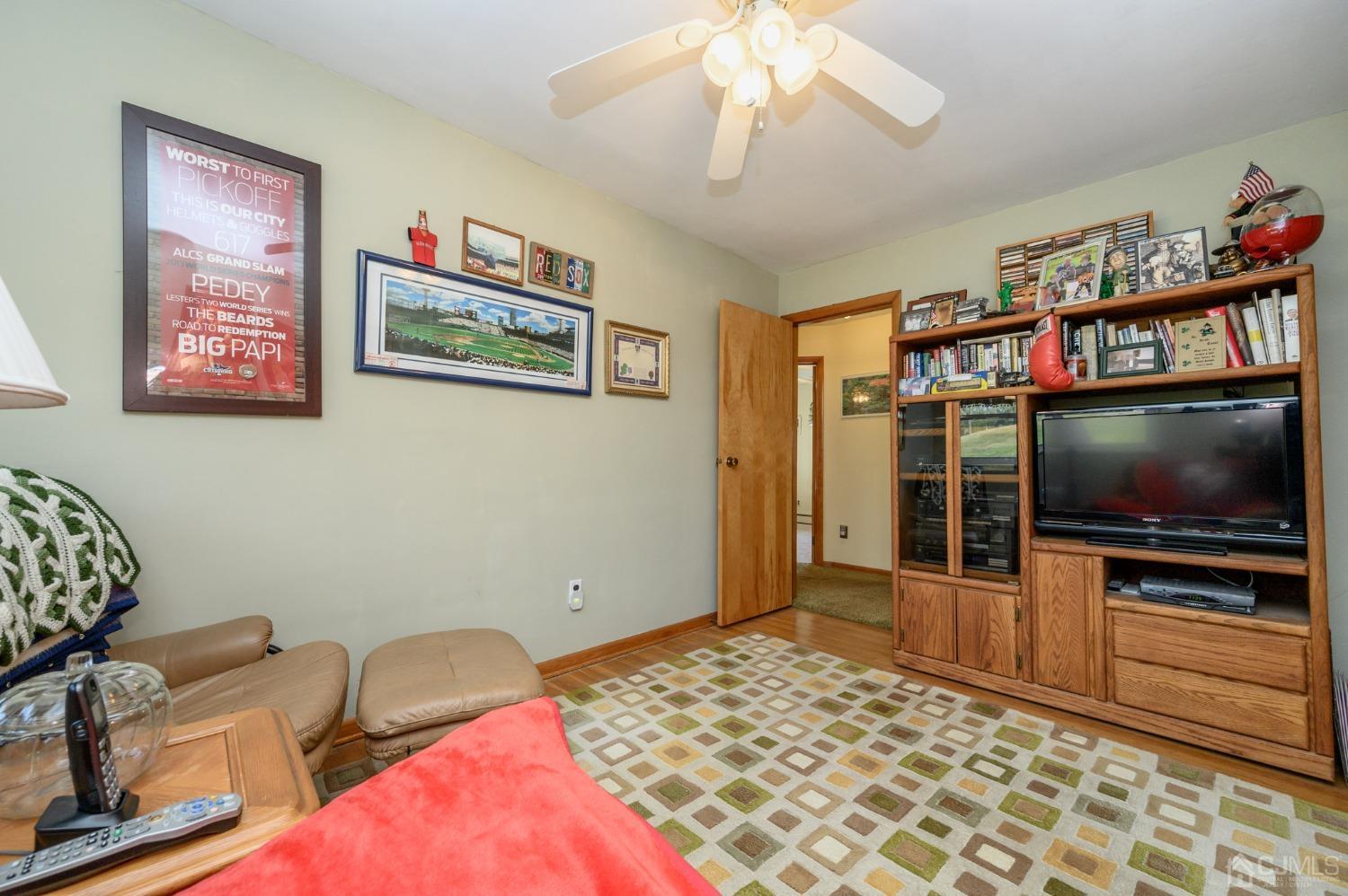 7 Putters Road Succasunna, NJ 07876 - Photo 18 of 40 a living room with furniture and a flat screen tv