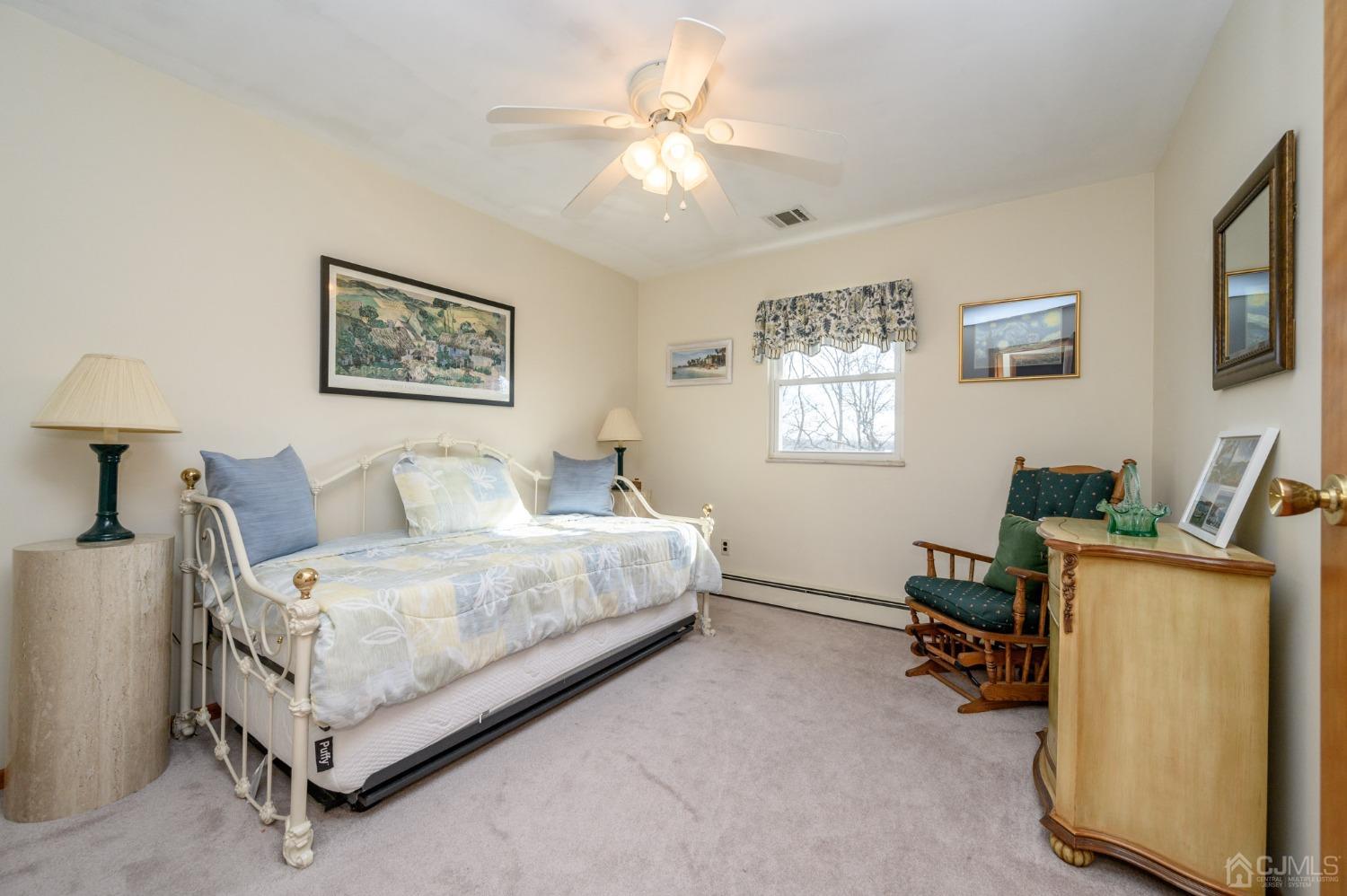7 Putters Road Succasunna, NJ 07876 - Photo 19 of 40 a spacious bedroom with a bed and a window