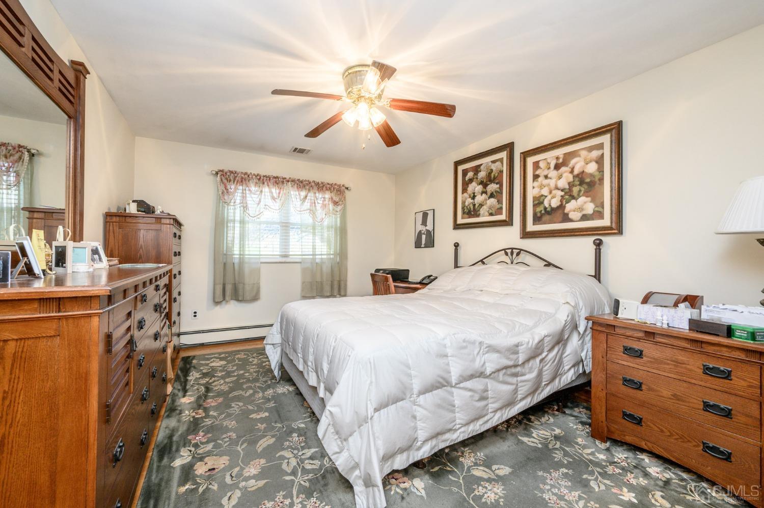 7 Putters Road Succasunna, NJ 07876 - Photo 22 of 40 a bedroom with a bed and wooden floor