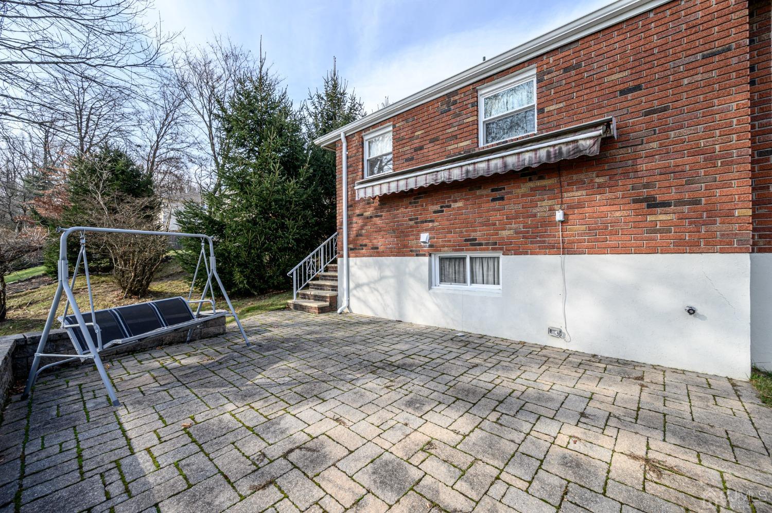 7 Putters Road Succasunna, NJ 07876 - Photo 29 of 40 a backyard of a house with seating space