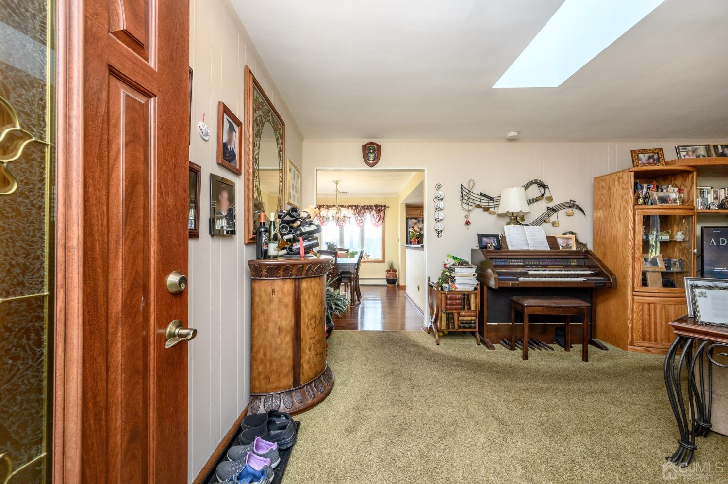 7 Putters Road Succasunna, NJ 07876 - Photo 3 of 40 a view of a livingroom with furniture and a flat screen tv